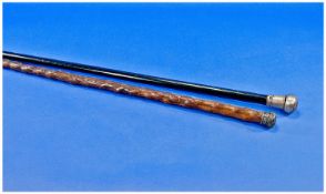 Two Silver Capped Walking Sticks, comprising one ebonised stick, the cap hallmarked for London