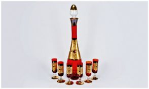Murano Style Red and Gilt Glass Liqueur Set comprising bottle shaped decanter with tall, narrow,
