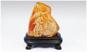 Chinese Two Tone Shoushan Stone with a carved scene of Buddha Sat in Discussion with two