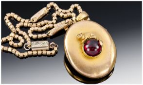 Early Victorian Fine Pinchbeck Oval Locket with large Cabucon cut Garnet to centre with the mounted