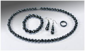 Four Piece Set of Faceted Hematite Jewellery comprising twenty-one inch long necklace with strong