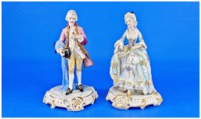 Pair of Capo-di-Monte Figures in 18th Century Dress, the lady predominantly in powder blue with