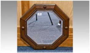 Oak Octagonal Wall Hanging Mirror, bevelled edge glass, beading to edges and convex roundels,