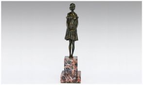 20th Century Art Deco Style Bronze Figure Of A Young Woman In A Low Cut Dress in a standing