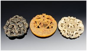 Set of Three Carved Oriental Pendants.