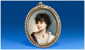 Early 20th Century Very Fine Ceramic and Oval Portrait Miniature of a young woman. Unsigned, 3.5