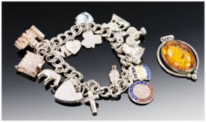 Silver Charm Bracelet, Loaded With 19 Charms, Complete With Padlock Fastener And Safety Chain.