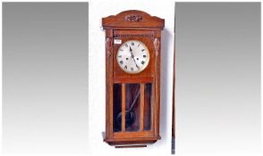 Gustav Becker Mahogany Cased Wall Clock, silvered dial and black Roman numerals, glazed door, 28