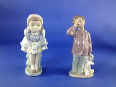 2 Nao Figures By Lladro boy with teddy & girl in dress crouched on a hedge,