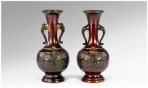 A Pair of Small Oriental bronze Vases with Elephant Head Handles. 19th Century, height 15cm.