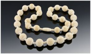 Ivory Necklace with pierced ball decoration. C 1920`s. 19.5 inches in length.