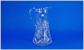 Large Cut Glass Jug, German, of waisted form, with faceted rim and faceted handle, the body with