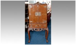 1960`s Walnut Veneered Cocktail Cabinet, the two doors opening to reveal mirror backed with