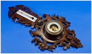 Early 20th Century Black Forest Style Ornate Carved Wooden Anriod Barometer. 19.25`` in height.