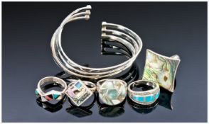 Collection Of Five Silver Rings Together With A Silver Bangle.