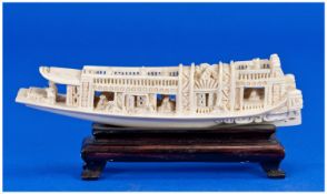 Chinese Vintage Ivory Boat With Figures, Raised on a wooden stand. 2.5`` in height, 6`` in width.