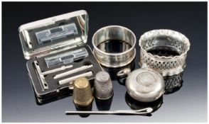Collection of Silver Items including two silver napkin rings, silver plated sovereign holder,