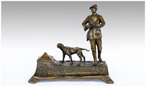 Bronzed Desk Tidy in the form of a Bavarian hunter with a pointer.