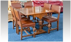 1930`s Oak Jacobean Style Oak Dining Suite, comprising folding table and six chairs, the table with