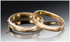 Two 1/5th 9ct Rolled Gold Hinged Bangles. A/F Weight 34.5 Grammes.