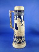 Large German Stein with raised scene of carousing below the sentiment in German, `With dancing and