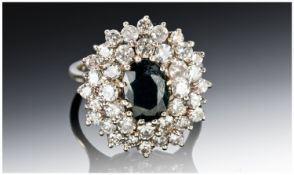 18ct White Gold Diamond Cluster Ring, Set With A Central Oval Sapphire Surrounded By 36 Round