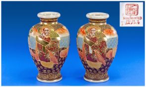Pair of Satsuma Ovoid Vases each having a hand painted, continuous polychrome enamel scene showing