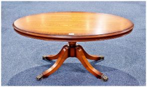 Modern Oval Mahogany Coffee Table, raised on four legs, 18 inches high, 39 wide and 20½ deep.