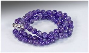 Amethyst Three Strand Bracelet fastened with a sterling silver slot-in bar clasp with 3 rings to