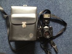 Zenit Helios TTL Camera, with adjustable lense and `Helios 28` flash light above, complete with
