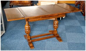 1930`s Oak Draw Leaf Table, with cup and cover supports, raised on a trestle base, 29½ inches high,