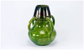 Belgian Majolica Four Handled Vase, Green Glazed, Height 10 Inches.