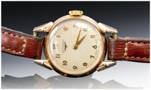 Longines-Vintage 18ct Gold Cased Wrist Watch. Manual wind, supported on a leather strap. c. 1950`s.