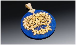 A Fine Round Lapis Lazuli Pendant with Applied Eastern Design in high carat Gold. 2`` High.