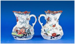 Pair of Mason`s Ironstone Chinoiserie Jugs each with an applied serpent handle, the pattern made