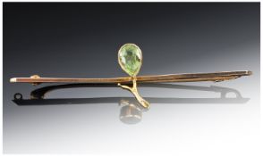 9ct Gold Brooch, Set With A Central Peridot, Length 58mm Stamped 9ct.