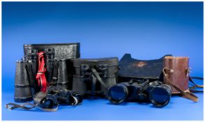 Collection of Four Binoculars, including Denhill 8 x 30, Prinz 8 x 30,  Prinz 10 x 50, and Optomax