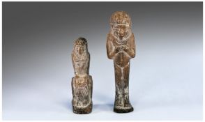 Pair of Egyptian Shabti Figures in carved limestone. 6.75 and 5.25 inches in height.