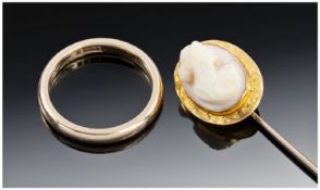 14ct Gold Wedding Band, stamped 14ct. 3.8 grams. Plus gold cameo stick pin. Not marked but tests