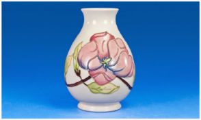 Walter Moorcroft Vase, `Hibiscus` Design on cream ground. 7.5 inches high