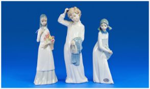 Lladro Style Figures (3) in total. Includes Nao figure of young girl in night dress and slippers.