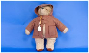 Paddington Bear with plush body and hat.