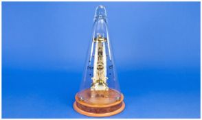 Franz Hermle Brass Skeleton Clock Under A Conical Glass Dome Raised On A Circular Wooden Base,