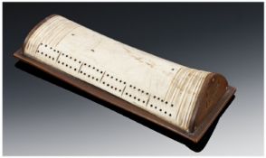 Rare 19th Century Bone Cribbage Board with fruitwood cradle. Initialled E.M and dated 1877. 6.5`` in