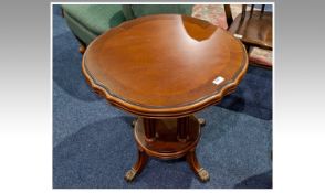 Modern Mahogany Veneered Coffee Table, the shaped top, raised on turned legs, supported on a
