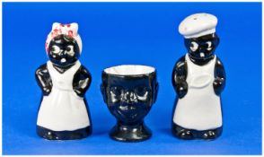 19th Century/ Early 20th Century Cruet Set in the form of Black people. together with an egg cup.