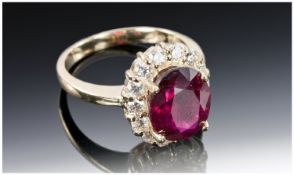 14ct Yellow Gold Ruby & Diamond Ring, Set With An Oval Cut Ruby (Estimated Weight 5.00ct) Surrounded