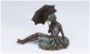 Erotic Vienna Bronze depicting a pretty seated lady wearing no underwear in a flowing blue dress