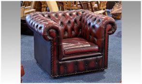Red Leather Deep Buttoned Chesterfield Armchair, measuring 28 inches high, 38 wide and 32.