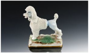 Staffordshire Style Miniature Figure of a Poodle, c 1860. 3 inches in height.